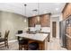 Beautiful kitchen featuring custom wood cabinets and a large granite island with seating at 38334 N 20Th St, Phoenix, AZ 85086