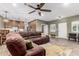 Cozy living room featuring a comfortable brown sectional sofa and access to other rooms at 38334 N 20Th St, Phoenix, AZ 85086