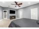 Comfortable main bedroom featuring a ceiling fan and neutral tones at 38334 N 20Th St, Phoenix, AZ 85086