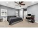 Comfortable main bedroom featuring a ceiling fan and a work space at 38334 N 20Th St, Phoenix, AZ 85086