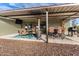 Inviting covered patio with an outdoor dining area, heater, and built-in grill, perfect for entertaining at 38334 N 20Th St, Phoenix, AZ 85086