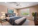 Relaxing bedroom with a king-size bed and large window at 15824 W Sage Trl, Surprise, AZ 85374