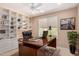 Home office with built-in shelving and a large desk at 15824 W Sage Trl, Surprise, AZ 85374