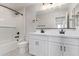 Modern bathroom with double vanity and subway tile at 11519 S 50Th Ave, Laveen, AZ 85339