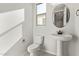 Modern bathroom with pedestal sink and toilet at 11519 S 50Th Ave, Laveen, AZ 85339