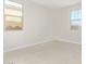 Spacious bedroom with large windows and grey carpet at 11519 S 50Th Ave, Laveen, AZ 85339