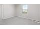 Bright bedroom with grey carpet and window at 11519 S 50Th Ave, Laveen, AZ 85339