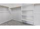 Large closet with shelves and hanging rods at 11519 S 50Th Ave, Laveen, AZ 85339