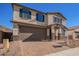 Two-story house with a large garage and a landscaped front yard at 11519 S 50Th Ave, Laveen, AZ 85339