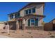 Two-story house with stone accents and a landscaped front yard at 11519 S 50Th Ave, Laveen, AZ 85339