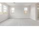 Bedroom with plush carpeting and two windows, connected to the bathroom at 19655 E Estrella Rd, Queen Creek, AZ 85142