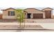 Charming single-story home featuring a 2-car garage, desert landscaping, and a welcoming entrance at 19655 E Estrella Rd, Queen Creek, AZ 85142