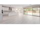Spacious living room open to the kitchen and features sliding doors to outdoor space at 19655 E Estrella Rd, Queen Creek, AZ 85142