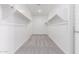 Spacious walk-in closet with multiple shelves and hanging rods offers ample storage at 19655 E Estrella Rd, Queen Creek, AZ 85142