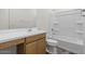 Clean bathroom with a single sink, vanity with wooden cabinets, and a shower-tub combo at 5729 S 243Rd Dr, Buckeye, AZ 85326