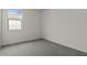 Bedroom featuring carpet floors, base molding, a window and neutral walls at 5729 S 243Rd Dr, Buckeye, AZ 85326