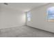 Bright bedroom featuring carpet floors, base molding, two windows and neutral walls at 5729 S 243Rd Dr, Buckeye, AZ 85326