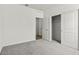Bedroom featuring carpet floors, base molding, a closet, and neutral walls at 5729 S 243Rd Dr, Buckeye, AZ 85326