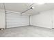 Spacious two-car garage with an automatic door and plenty of storage space at 5729 S 243Rd Dr, Buckeye, AZ 85326