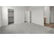 Spacious main bedroom with carpet, walk-in closet, ensuite bath, and neutral walls at 5729 S 243Rd Dr, Buckeye, AZ 85326