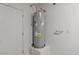 Indoor water heater next to a white door with carpet on the floor at 5729 S 243Rd Dr, Buckeye, AZ 85326