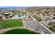 Aerial view of community featuring lake, park, and residential homes at 1521 W Commerce Ave, Gilbert, AZ 85233