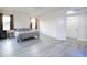 Bright bedroom with gray bedding and wood-look floors at 1521 W Commerce Ave, Gilbert, AZ 85233