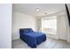 Bedroom with blue bedding and window seat at 1521 W Commerce Ave, Gilbert, AZ 85233