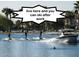 Residents waterskiing on the community lake at 1521 W Commerce Ave, Gilbert, AZ 85233