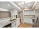 Modern kitchen with white cabinets, granite countertops, and stainless steel sink at 9140 W Kimberly Way, Peoria, AZ 85382