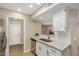 Clean kitchen with white cabinets, granite countertops, and stainless steel appliances at 9140 W Kimberly Way, Peoria, AZ 85382