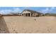 Rear view of home showing the expansive backyard with plenty of space for outdoor activities at 19679 E Estrella Rd, Queen Creek, AZ 85142
