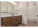 Bathroom featuring wooden cabinets, white countertops, and modern fixtures at 19679 E Estrella Rd, Queen Creek, AZ 85142