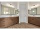 Bathroom with double vanity, wood cabinets, and tiled floors at 19679 E Estrella Rd, Queen Creek, AZ 85142