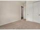 Clean, carpeted bedroom with a double-door closet and neutral wall color at 19679 E Estrella Rd, Queen Creek, AZ 85142