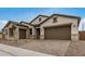 Beautiful home with a brick driveway, and a tandem three car garage at 19679 E Estrella Rd, Queen Creek, AZ 85142