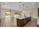 Kitchen island with stainless steel appliances and view to back patio at 19679 E Estrella Rd, Queen Creek, AZ 85142
