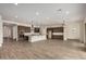 Large living area with tile floors, and kitchen with island at 19679 E Estrella Rd, Queen Creek, AZ 85142