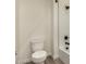Close up on a toilet and the shower/tub area at 19679 E Estrella Rd, Queen Creek, AZ 85142