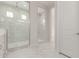 Bathroom showcasing a spacious walk-in shower with marble tile and glass enclosure at 21921 S 197Th St, Queen Creek, AZ 85142