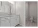 Bathroom featuring neutral color palette, vanity with quartz countertop, and a toilet at 21921 S 197Th St, Queen Creek, AZ 85142