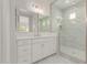 Bathroom featuring vanity, marble countertop, framed mirror, and glass-enclosed shower at 21921 S 197Th St, Queen Creek, AZ 85142