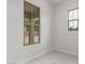 Corner bedroom featuring light gray wood floors and windows overlooking the backyard at 21921 S 197Th St, Queen Creek, AZ 85142