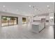 Bright and airy kitchen area with island and access to the backyard through sliding glass doors at 21921 S 197Th St, Queen Creek, AZ 85142