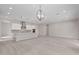 Open-concept living space with kitchen and dining areas, perfect for modern living and entertaining at 21921 S 197Th St, Queen Creek, AZ 85142