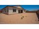 Backyard features neutral colored walls and dirt at 17225 W Calle Lejos --, Surprise, AZ 85387