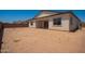 Backyard features neutral colored walls and dirt at 17225 W Calle Lejos --, Surprise, AZ 85387