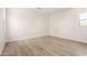 This spacious bedroom features wood-look floors and abundant natural light at 17225 W Calle Lejos --, Surprise, AZ 85387