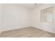 Bedroom featuring a bright window, neutral walls, and modern flooring at 17225 W Calle Lejos --, Surprise, AZ 85387