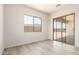 Bright bedroom with a window and sliding door showcasing the backyard at 17225 W Calle Lejos --, Surprise, AZ 85387